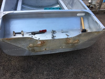 Outer transom after wood removal. Extra holes mean it was probably replaced sometime ago. Bottom two holes were open to the water...