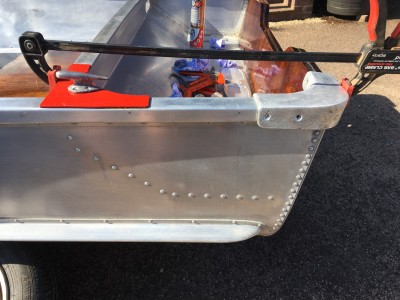 Clamp used to align the mounting holes. There are 2 screws on the side, 2 on the outer transom and 2 on the inner (1 on the side gunwales, one in the wood inner transom) section
