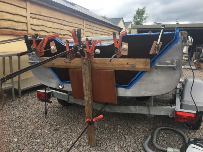 Outer transom clamped and curing. The bottom clamp is on the trailer crossmember.